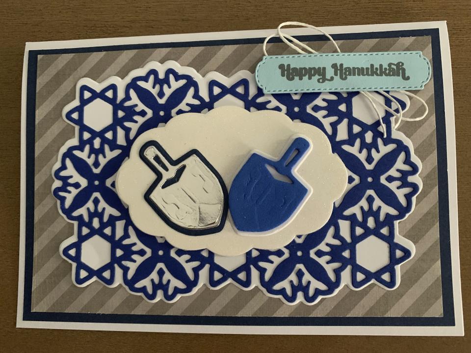 This image provided by Tiziana Fox shows a handmade Hanukkah card. Handmade holiday cards can be gifts in themselves for both maker and receiver. They're a way to express creativity and connection. And gathering to make them can be a nice social activity. (Tiziana Fox via AP)