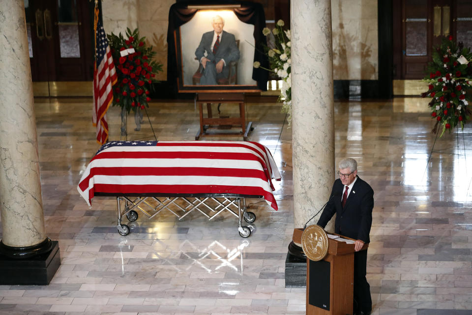 Mississippi Gov. Phil Bryant, right, makes remarks at the funeral of the late Republican senator Thad Cochran, after first paying his respects in the Mississippi State Capitol rotunda in Jackson, Miss., Monday, June 3, 2019. Cochran was 81 when he died Thursday in a veterans' nursing home in Oxford, Miss. (AP Photo/Rogelio V. Solis)