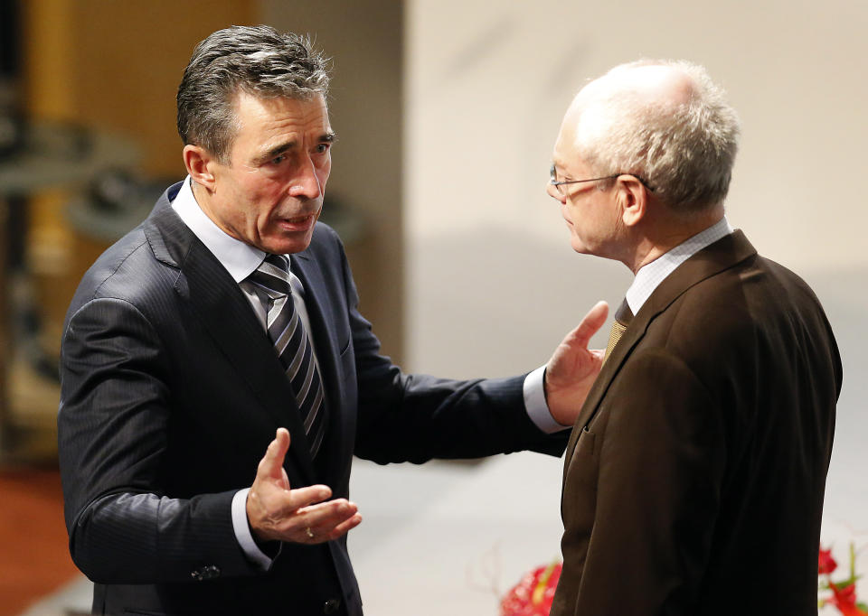 NATO secretary General Anders Fogh Rasmussen, left, and European Council President Herman Van Rompuy chat during the 50th Security Conference in Munich, Germany, Saturday, Feb. 1, 2014. A three-day security meeting continues. (AP Photo/Frank Augstein)