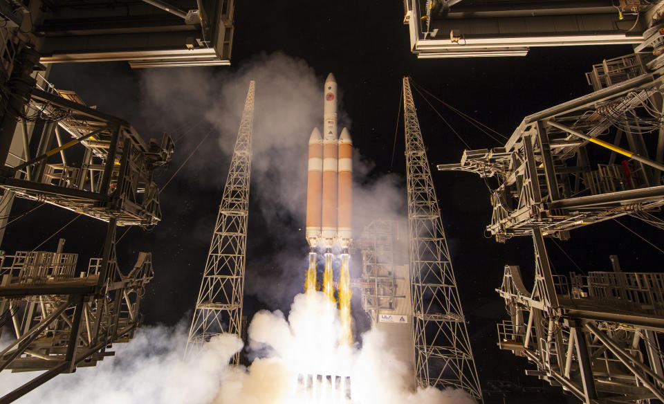 A Delta IV rocket, carrying the Parker Solar Probe, lifts off from launch complex 37 at the Kennedy Space Center, Sunday, Aug. 12, 2018, in Cape Canaveral, Fla. The Parker Solar Probe will venture closer to the Sun than any other spacecraft and is protected by a first-of-its-kind heat shield and other innovative technologies that will provide unprecedented information about the Sun. (Bill Ingalls/NASA via AP)