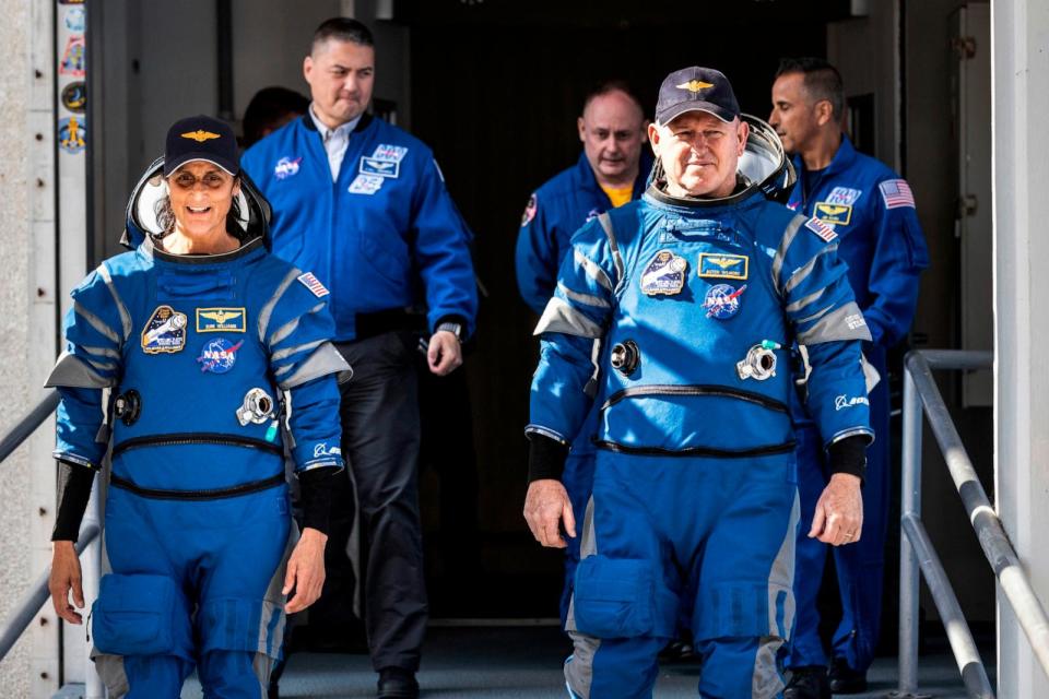 PHOTO: NASA's Boeing Crew Flight Test astronauts Suni Williams and Butch Wilmore exit the Neil A. Armstrong Operations and Checkout Building at the agency's Kennedy Space Center in Florida during a mission dress rehearsal, April 26, 2024.  (Frank Micheaux/AP, FILE)