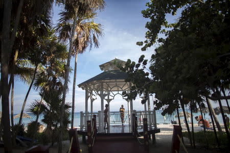 Tourists enjoy the beach in Varadero, Cuba, August 26, 2015. REUTERS/Alexandre Meneghini