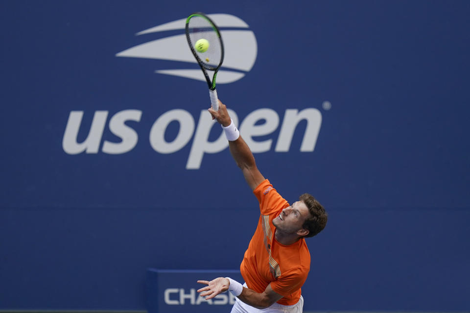 Pablo Carreno Busta, of Spain, serves to Novak Djokovic, of Serbia, during the fourth round of the US Open tennis championships, Sunday, Sept. 6, 2020, in New York. (AP Photo/Seth Wenig)