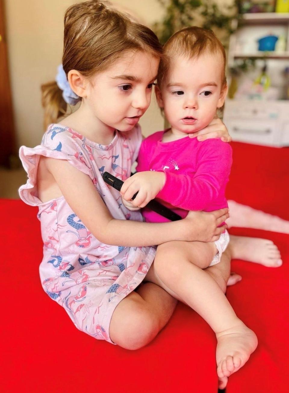 Natalie and her sister, Margot, 18 months, in July.