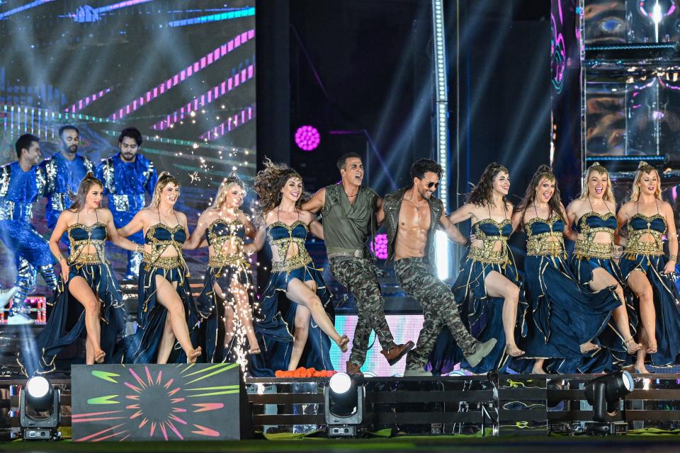 Bollywood actors Akshay Kumar (C) and Tiger Shroff (C, right) perform during the opening ceremony of the Indian Premier League (IPL) at the MA Chidambaram Stadium in Chennai on March 22, 2024.