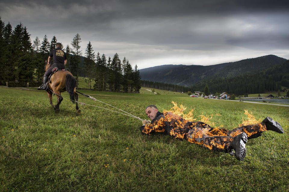 The longest distance for being pulled by a horse while on full body burn is 1,640.42 feet. The record is achieved by stuntman Josef T&ouml;dtling of Austria in June, 2015.