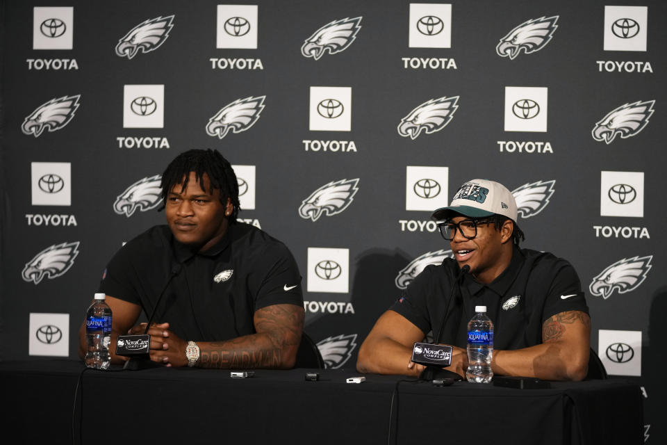 Newly drafted Philadelphia Eagles' Nolan Smith, right, and Jalen Carter speak during a news conference at the NFL football team's training facility, Friday, April 28, 2023, in Philadelphia. (AP Photo/Matt Slocum)