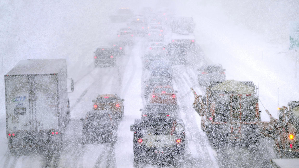 Plows, at right, try to pass nearly stopped traffic, due to weather conditions, on Route 93 South, Tuesday, March 14, 2023, in Londonderry, N.H. By the time the winter storm wraps up Wednesday, snow totals in New England are expected to reach a couple of feet of snow in higher elevations to several inches along the coast. (AP Photo/Charles Krupa)