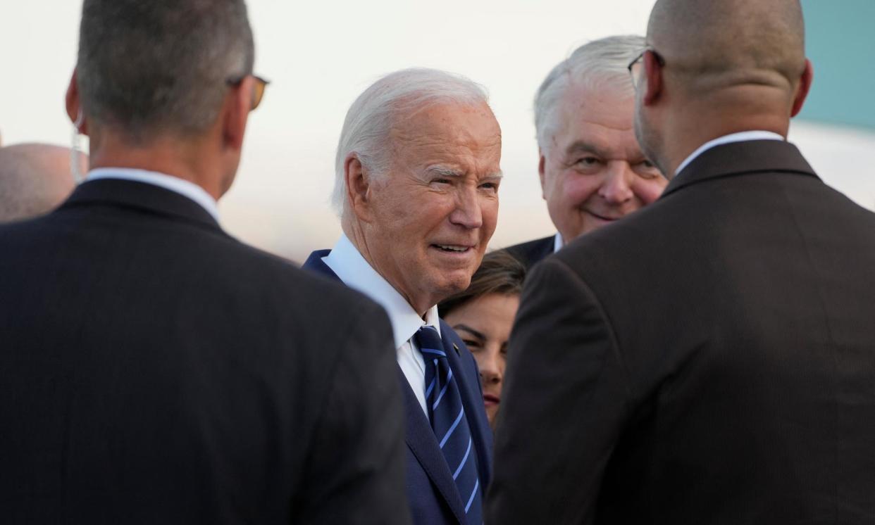 <span>Joe Biden talks to people welcoming him after stepping off Air Force One in Las Vegas, Nevada.</span><span>Photograph: Kent Nishimura/AFP/Getty Images</span>