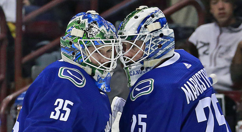 VANCOUVER, BC - MARCH 9: Thatcher Demko #35 of the Vancouver Canucks is switch out with teammate Jacob Markstrom #25 during their NHL game against the Vegas Golden Knights at Rogers Arena March 9, 2019 in Vancouver, British Columbia, Canada.  (Photo by Jeff Vinnick/NHLI via Getty Images)