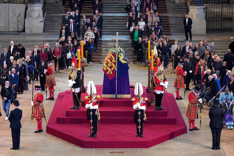 14 September 2022: The first members of the public pay their respects as the vigil begins around the coffin of Queen Elizabeth II in Westminster Hall, London, where it will lie in state ahead of her funeral on Monday (PA)