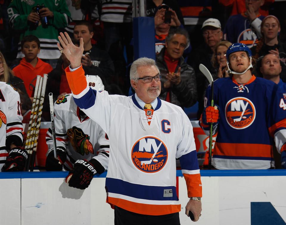 UNIONDALE, NY - DECEMBER 13: Former New York Islander Clark Gillies is honored prior to the game against the Chicago Blackhawks aat the Nassau Veterans Memorial Coliseum on December 13, 2014 in Uniondale, New York.  (Photo by Bruce Bennett/Getty Images)