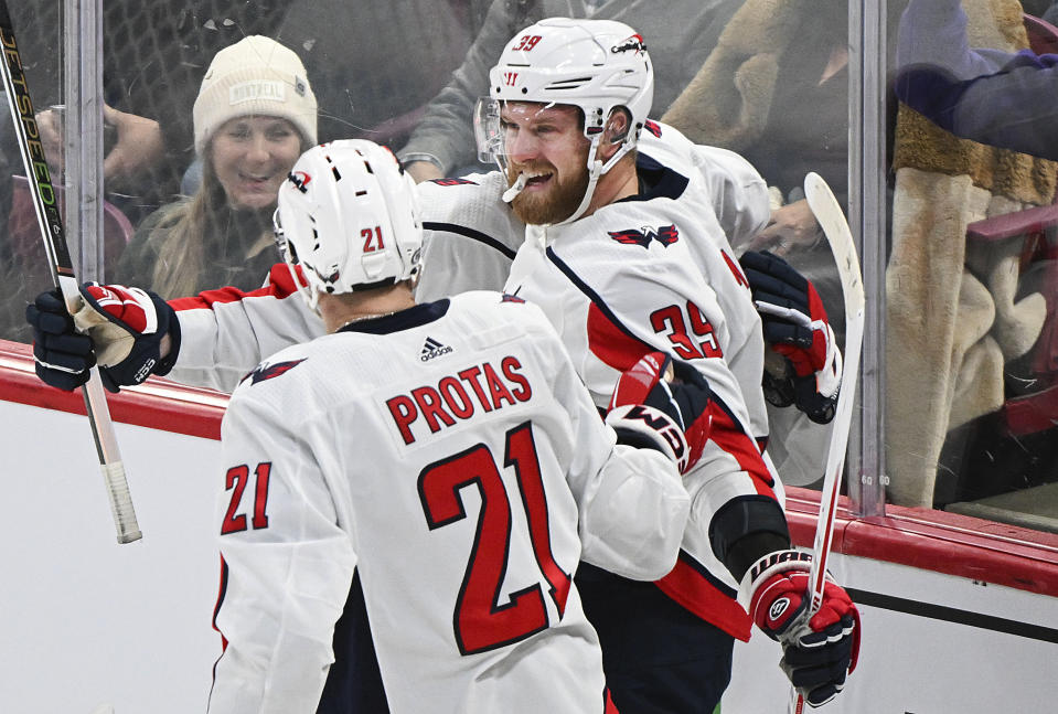 Washington Capitals' Anthony Mantha (39) celebrates with Aliaksei Protas after scoring against the Montreal Canadiens during the first period of an NHL hockey game Saturday, Feb. 17, 2024, in Montreal. (Graham Hughes/The Canadian Press via AP)