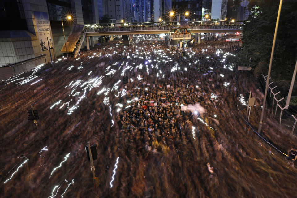 A blur of thousands of protesters march on the streets against an extradition bill in Hong Kong on Sunday, June 16, 2019. Hong Kong residents Sunday continued their massive protest over an unpopular extradition bill that has highlighted the territory's apprehension about relations with mainland China, a week after the crisis brought as many as 1 million into the streets. (AP Photo/Vincent Yu)