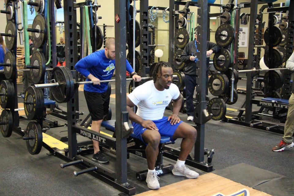 Defensive end Tolu Ogrunrinde prepares to test on the bench press during Wednesday's South Dakota State football Pro Day.