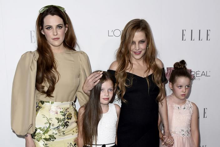 Lisa Marie Presley, second right, her daughter Riley Keough, left, and her twin daughters Finley Lockwood and Harper Lockwood