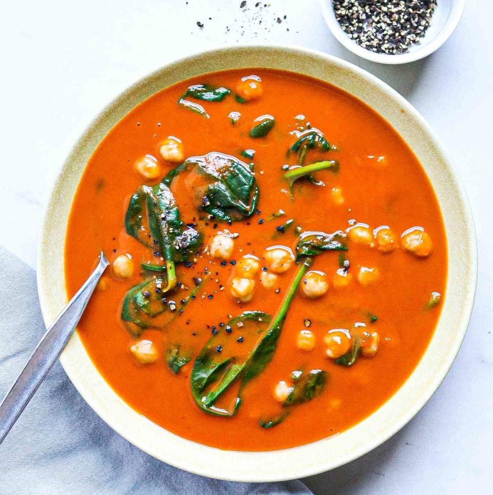 <p>Boxed blended soups are the perfect canvas for simple stir-ins to make them more substantial and satisfying. Here, roasted red pepper soup is jazzed up with canned chickpeas and fresh baby spinach for a fast, comforting meal.</p> <p> <a href="https://www.eatingwell.com/recipe/7889677/3-ingredient-roasted-red-pepper-soup-with-chickpeas/" rel="nofollow noopener" target="_blank" data-ylk="slk:View Recipe;elm:context_link;itc:0;sec:content-canvas" class="link ">View Recipe</a></p>