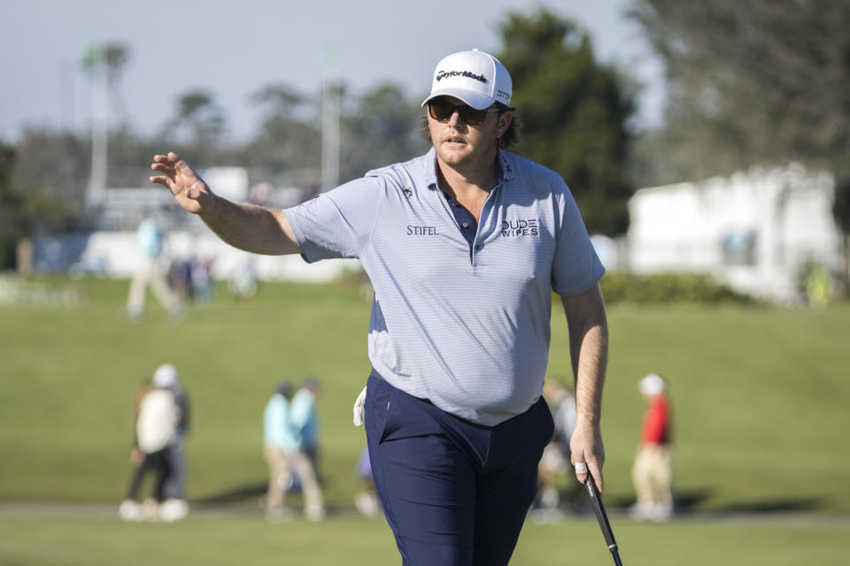 Harry Higgs waves at the crowd after finishing on the 18th green during the second round of the RSM Classic golf tournament, Friday, Nov. 18, 2022, in St. Simons Island, Ga. (AP Photo/Stephen B. Morton)