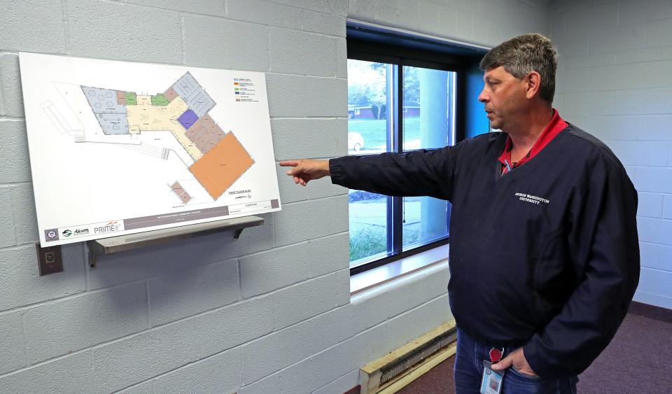 Jeff Incorvia, supervisor of Patterson Park Community Center, goes over a floor plan of its soon-to-be built replacement Wednesday in Akron.