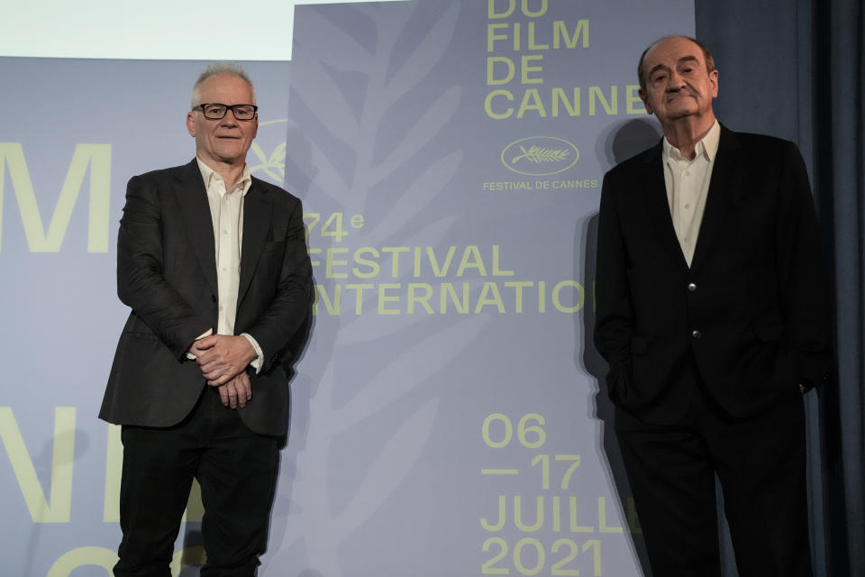 Festival director Thierry Fremaux, left and Festival president Pierre Lescure during the presentation of the official selection of the 74th International Cannes Film Festival, in Paris, Thursday, June 3, 2021. (AP Photo/Francois Mori)