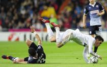 Real Madrid's midfielder Jose Maria Callejon (R) vies with Dinamo Zagreb's Argentinian defender Luis Ibanez (L) during the Champions League group D football match between Real Madrid and Dinamo Zagreb at the Santiago Bernabeu stadium in Madrid on November 22, 2011. AFP PHOTO/JAVIER SORIANO (Photo credit should read JAVIER SORIANO/AFP/Getty Images)