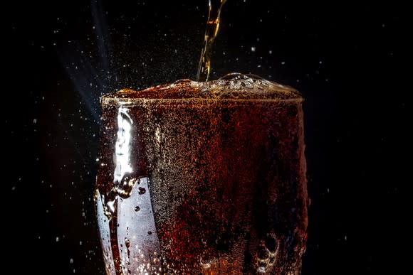 Soda pouring into a glass