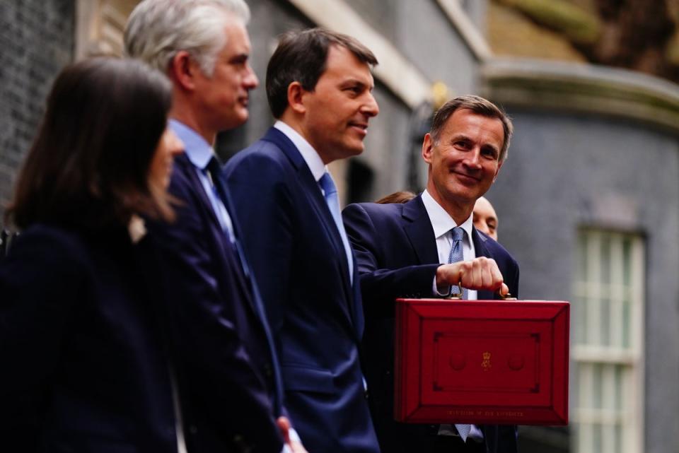 Chancellor of the Exchequer Jeremy Hunt leaves 11 Downing Street, London, with his ministerial box before, before delivering his Budget at the Houses of Parliament (PA)