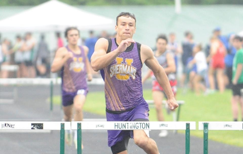 Unioto's Maddox Fox goes to clear a hurdle during the boys 300m hurdles in the Scioto Valley Conference track and field championships at Huntington High School on May 12, 2023.
