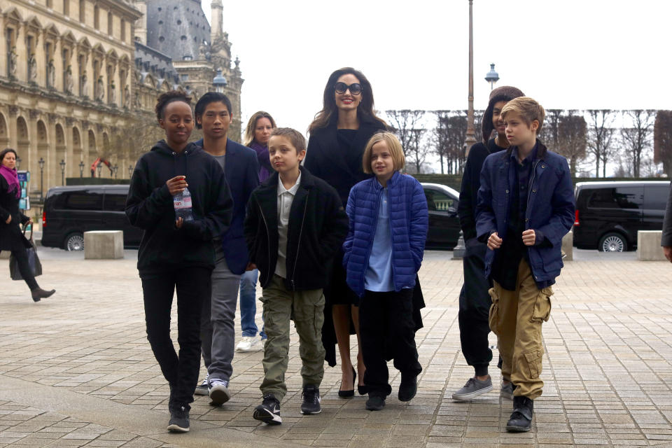 When Jolie worked in London this summer, Pitt went along to spend time with the children (pictured: Zahara, Pax, Knox, Vivienne, Maddox, and Shiloh with their mother in 2017). (Photo: Mehdi Taamallah/Nurphoto)