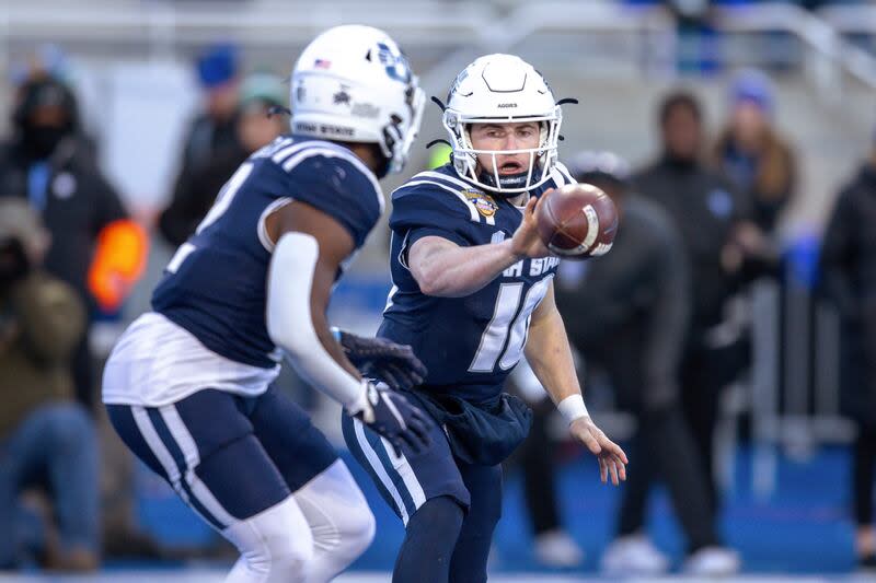 Utah State quarterback McCae Hillstead (10) pitches the ball to Robert Briggs Jr. during the Famous Idaho Potato Bowl game against Georgia State, Saturday, Dec. 23, 2023, in Boise, Idaho. The former Aggie was picked up by BYU after entering the transfer portal. | Steve Conner, Associated Press