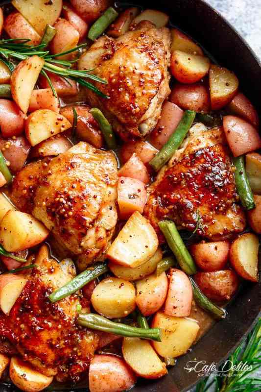 <p>Cafe Delites</p><p>Honey mustard chicken and potatoes are all made in one pan! Juicy, succulent chicken pieces are cooked in the best honey mustard sauce, surrounded by green beans and potatoes for a complete meal!</p><p><strong>Get the recipe: <a href="https://cafedelites.com/honey-mustard-chicken-potatoes/" rel="nofollow noopener" target="_blank" data-ylk="slk:One-Pan Honey Mustard Chicken and Potatoes;elm:context_link;itc:0;sec:content-canvas" class="link ">One-Pan Honey Mustard Chicken and Potatoes</a></strong></p><p><strong>Related: <a href="https://parade.com/1388138/kristamarshall/leftover-chicken-recipes/" rel="nofollow noopener" target="_blank" data-ylk="slk:55 Best Leftover Chicken Recipes;elm:context_link;itc:0;sec:content-canvas" class="link ">55 Best Leftover Chicken Recipes</a></strong></p>