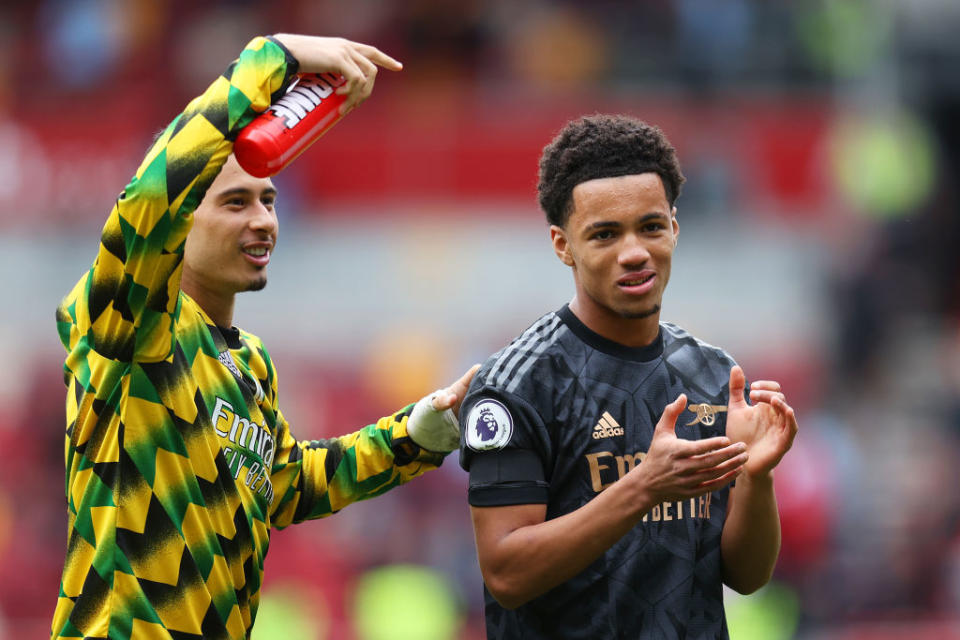 Ethan Nwaneri (R) of Arsenal applauds the fans next to Gabriel Martinelli following the Premier League match between Brentford FC and Arsenal FC at Brentford Community Stadium on September 18, 2022 in Brentford, England.