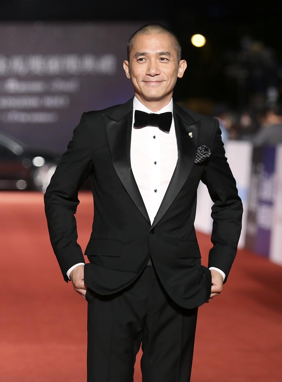 Hong Kong actor Tony Leung poses for photographers at the 50th Golden Horse Film Awards in Taipei