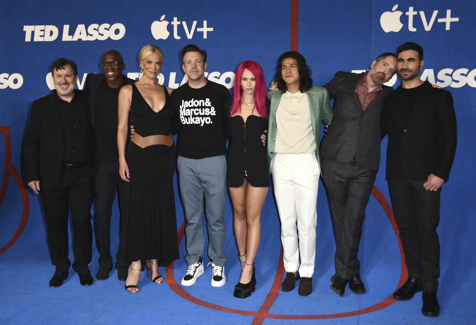 From left, co-stars Jeremy Swift, Moe Jeudy-Lamour, Hannah Waddingham, Jason Sudeikis, Juno Temple, Cristo Fernendez, Brendan Hunt and Brett Goldstein arrive at the premiere of the second season of 