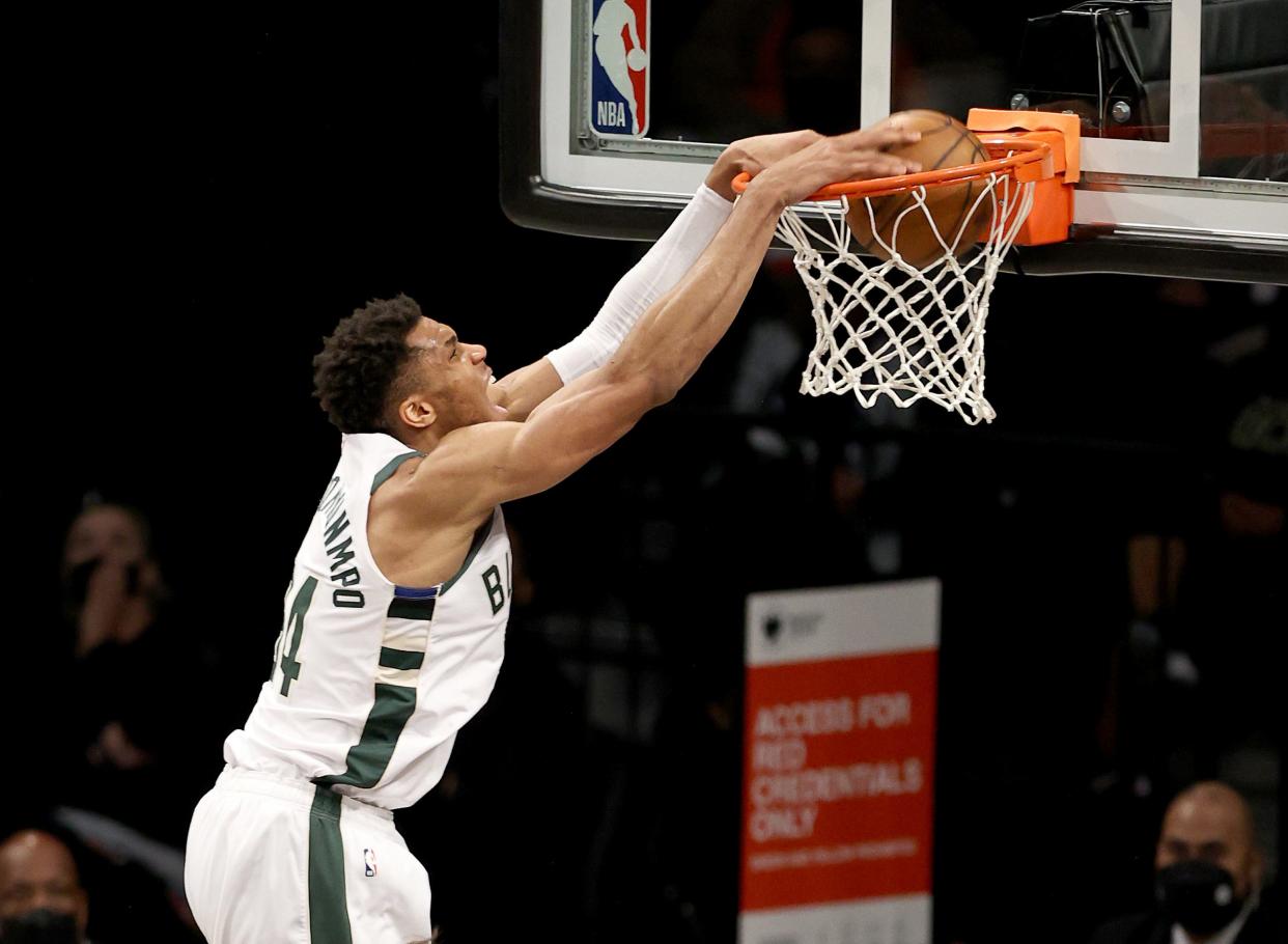 Giannis Antetokounmpo dunks in the second half against the Brooklyn Nets.