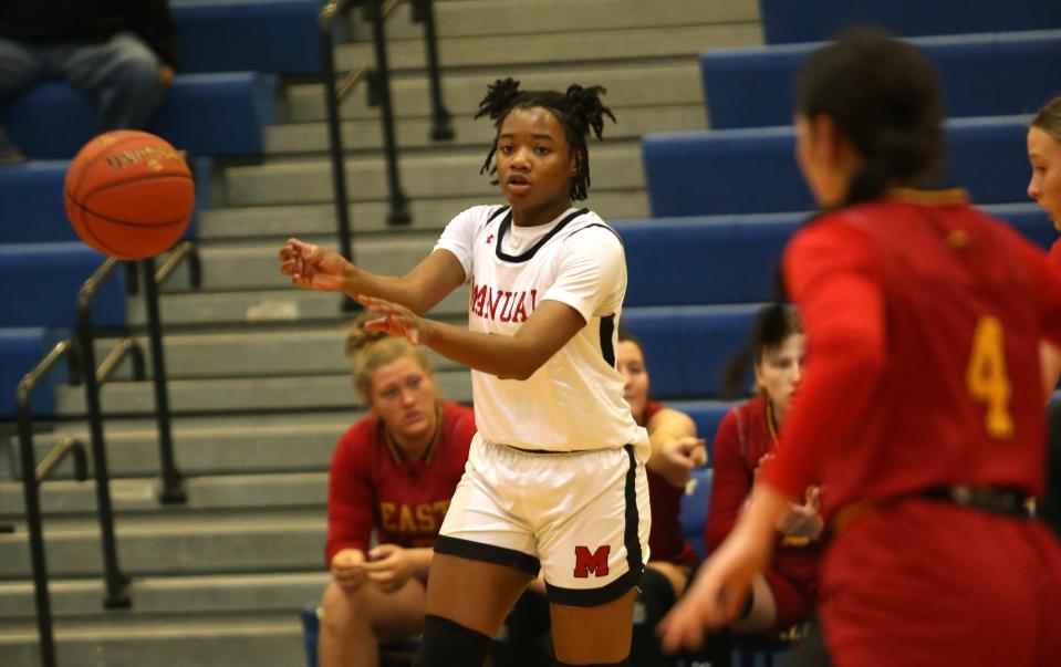 Manual’s Jakayla Thomson makes a pass against Bullitt East’s Logan Ortega. Jan. 27, 2023