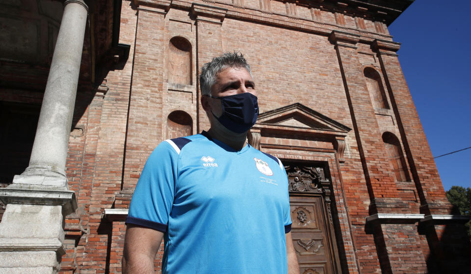 Mattia Maestri answers reporters' questions prior to the start of a 180-kilometer relay race, in Codogno, Italy, Saturday, Sept. 26, 2020. Italy’s coronavirus Patient No. 1, whose case confirmed one of the world’s deadliest outbreaks was underway, is taking part in a 180-kilometer relay race as a sign of hope for COVID victims after he himself recovered from weeks in intensive care. Mattia Maestri, a 38-year-old Unilever manager, was suited up Saturday for the start of the two-day race between Italy’s first two virus hotspots. It began in Codogno, where Maestri tested positive Feb. 21, and was ending Sunday in Vo’Euganeo, where Italy’s first official COVID death was recorded the same day. (AP Photo/Antonio Calanni)