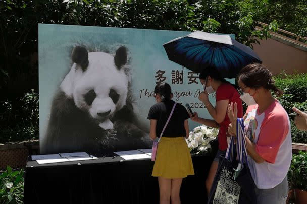 PHOTO: Visitors write notes to mourn the death of Chinese giant panda An An at the Ocean Park of Hong Kong, Thursday, July 21, 2022. The oldest-ever male giant panda in captivity has died at age 35 at the Hong Kong theme park after his health failed.  (AP Photo/Kin Cheung)