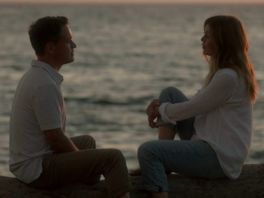George and Meredith sitting on a serene beach in a Greys Anatomy dream