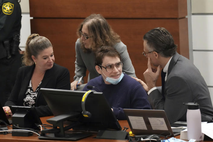 Marjory Stoneman Douglas High School shooter Nikolas Cruz, center, speaks with his defense team during the penalty phase of Cruz's trial at the Broward County Courthouse in Fort Lauderdale, Fla. on Tuesday, Sept. 27, 2022. Cruz previously plead guilty to all 17 counts of premeditated murder and 17 counts of attempted murder in the 2018 shootings. (Amy Beth Bennett/South Florida Sun Sentinel via AP, Pool)