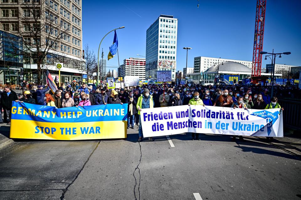 People take part in the demonstration "Stop the war! Peace and solidarity for the people in Ukraine" in Berlin, Germany, Sunday, March 13, 2022. (Fabian Sommer/dpa via AP)