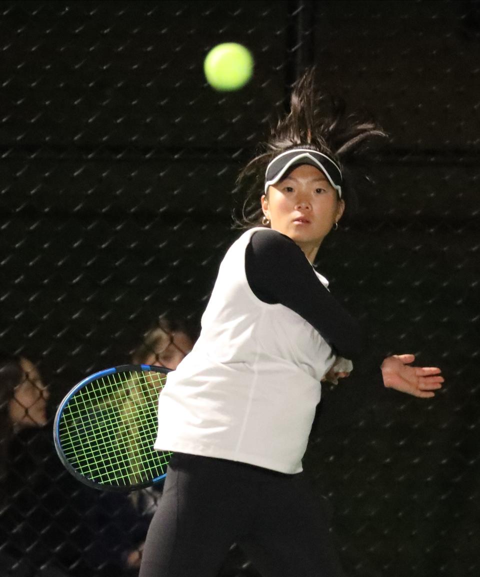 Scarsdale's Natalie Hu  returns a shot to Harrison's Hannah Rose during the Section One Division One girls tennis team finals at Harrison High School, Oct. 18, 2022. 