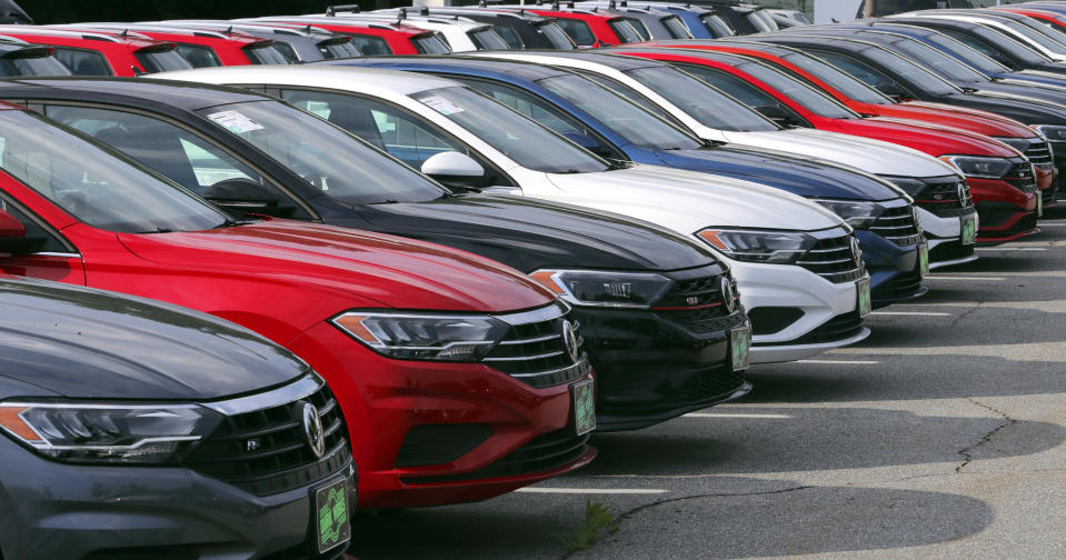 In this July 10, 2019, photo Volkswagen Jetta sedans are lined up at the Quirk dealership in Manchester, N.H. On Tuesday, July 16, the Commerce Department releases U.S. retail sales data for June. (AP Photo/Charles Krupa)