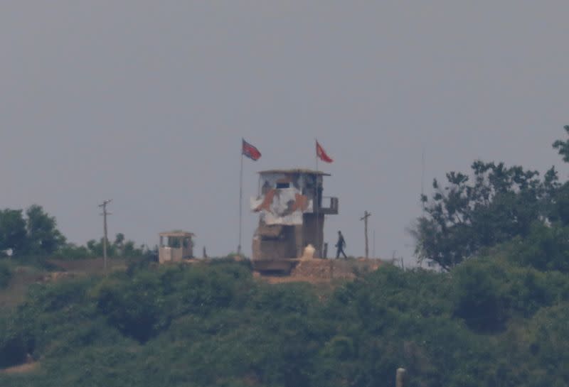 A North Korean soldier is seen beside his guard post inside North Korean territory in this picture taken near the demilitarized zone separating the two Koreas in Paju