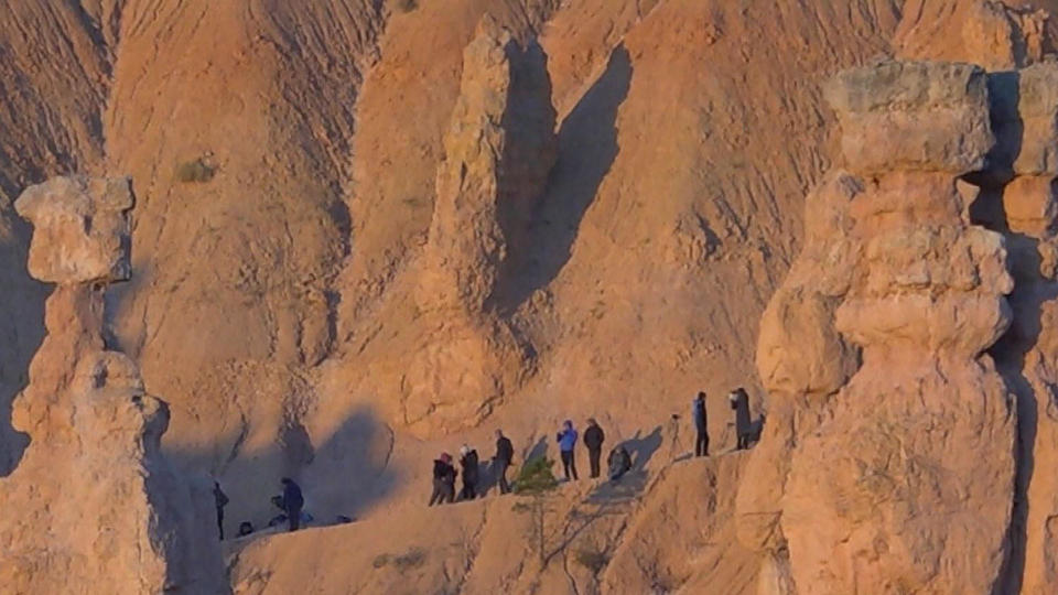 Hikers view the partial solar eclipse in Bryce Canyon, Utah. Oct. 14, 2023 . / Credit: CBS News