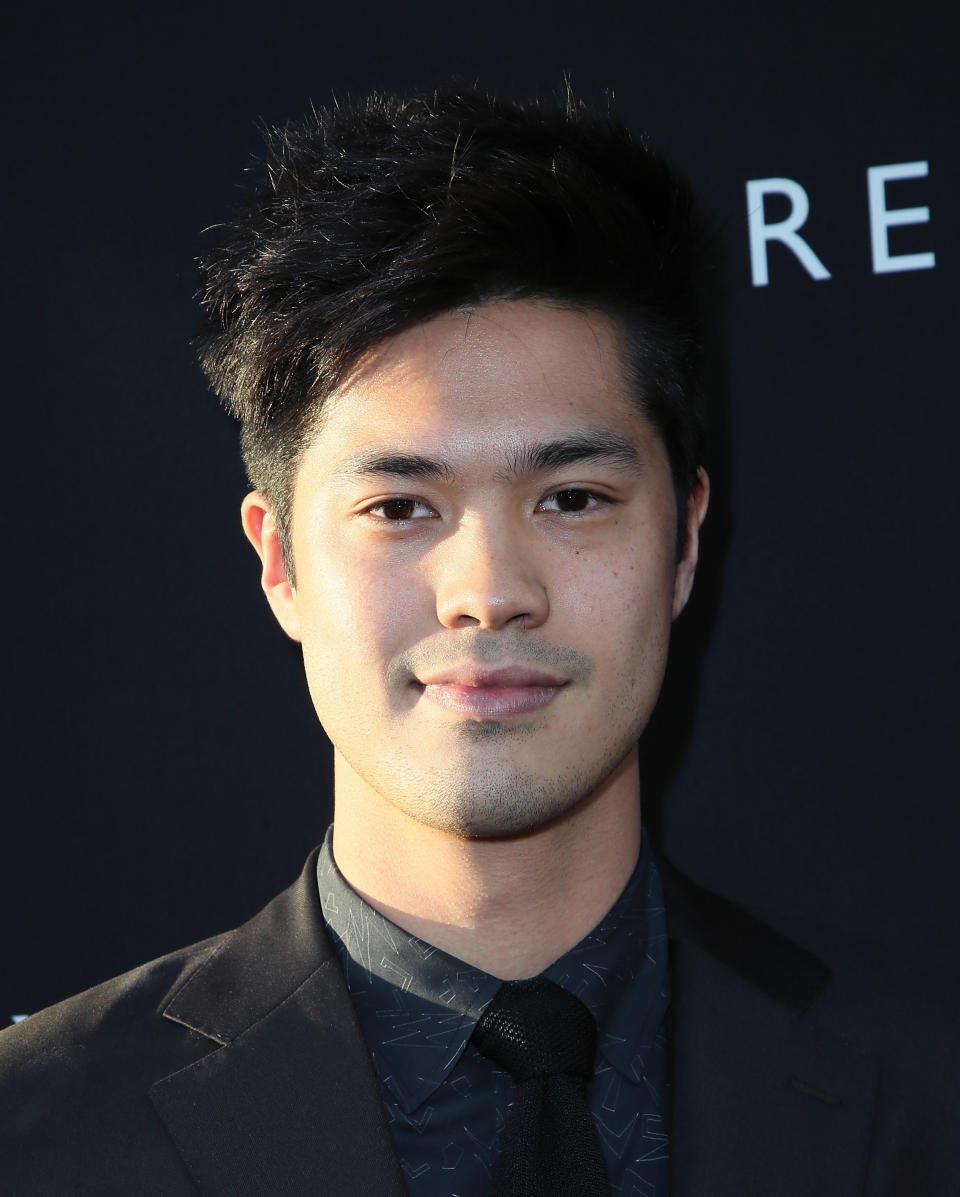 Ross Butler posing on a red carpet