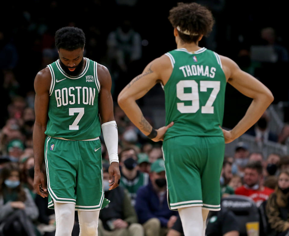 BOSTON MA - December 29: Jaylen Brown #7 and Brodric Thomas #97 of the Boston Celtics show their defeat during the second half of the NBA game against the Los Angeles Clippers at the TD Garden on December 29, 2021 in Boston, Massachusetts.  (Staff Photo By Matt Stone/MediaNews Group/Boston Herald)