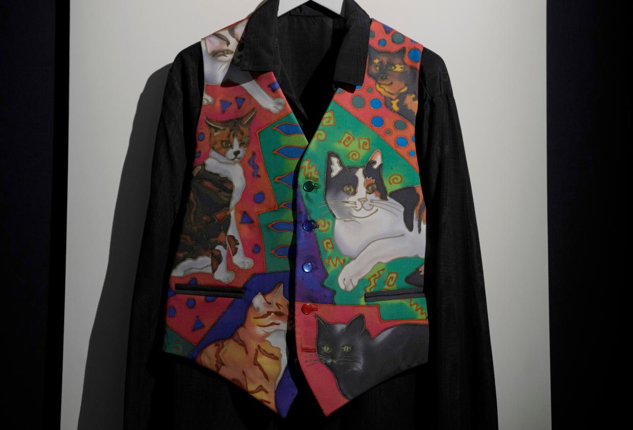 Freddie Mercury's silk waistcoat featuring portraits of Freddie Mercury's six cats, painted by Nerissa Ratcliffe, displayed at Sotheby's auction rooms in London on Aug. 3, 2023.