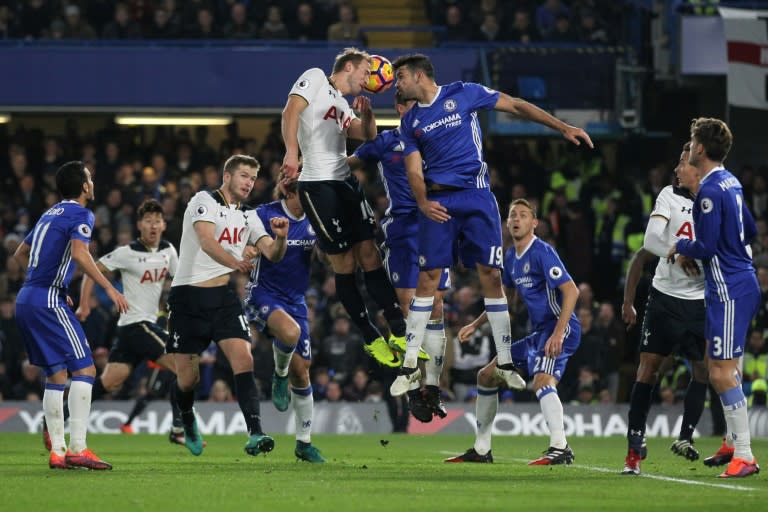 Tottenham Hotspur's striker Harry Kane (CL) and Chelsea's striker Diego Costa (CR) go up for a header during the English Premier League football match November 26, 2016