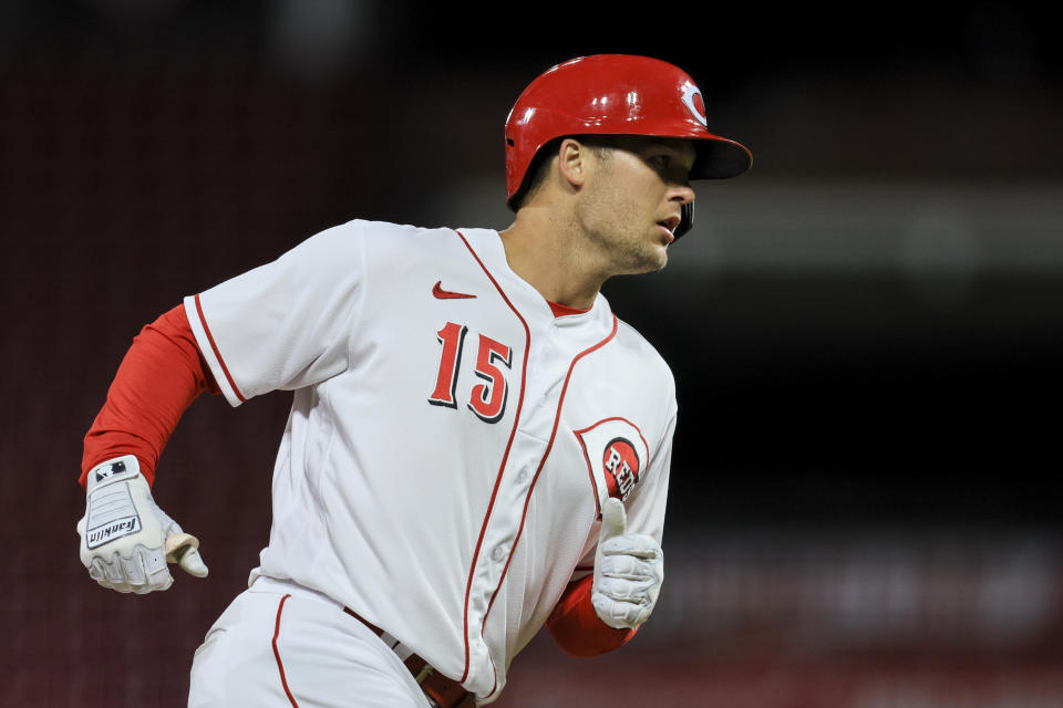 Cincinnati Reds' Nick Senzel runs the bases after hitting a solo home run during the ninth inning of the team's baseball game against the San Diego Padres in Cincinnati, Tuesday, April 26, 2022. The Padres won 9-6. (AP Photo/Aaron Doster)
